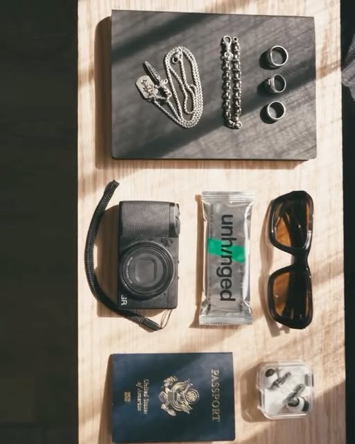 Camera, passport, sunglasses and an Unhinged bar, packed for travel