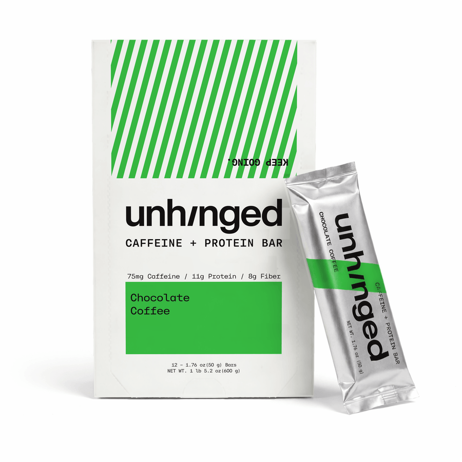 A box of Unhinged Caffeine + Protein Bars next to a single silver and green foil packet of Chocolate Coffee flavor, on a clean white background.