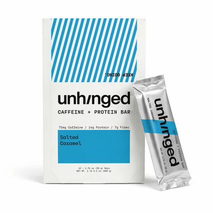 A box of unHged Caffeine + Protein Bar in Salted Caramel flavor, shown next to a single silver and blue foil packet on a clean white background.