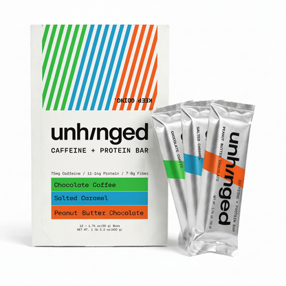 A box of unhnged Caffeine + Protein Bar with three individual silver stick packs standing beside it on a clean white background. The packaging features a white base with diagonal green, blue, and orange stripes at the top and flavor blocks indicating Chocolate Coffee, Salted Caramel, and Chocolate Peanut Butter.