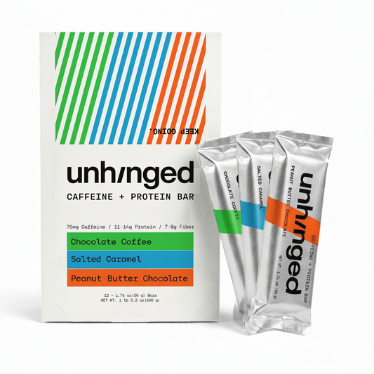 A box of unhnged Caffeine + Protein Bar with three individual silver stick packs standing beside it on a clean white background. The packaging features a white base with diagonal green, blue, and orange stripes at the top and flavor blocks indicating Chocolate Coffee, Salted Caramel, and Chocolate Peanut Butter.