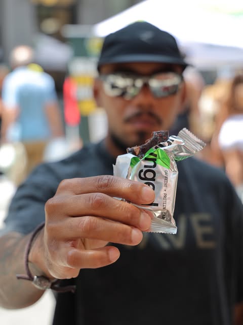Handing an Unhinged bar straight to the camera at a street fair